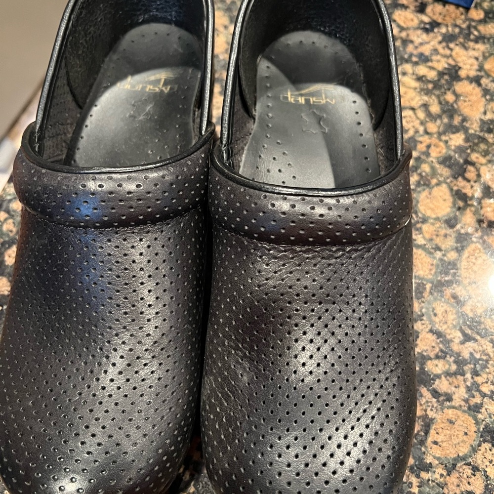 Dansko women’s Black Perforated clogs